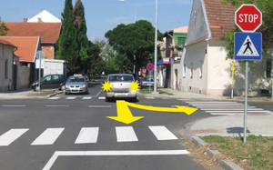 Slika uz pitanje: U situaciji prikazanoj na slici kretanje vozila unazad